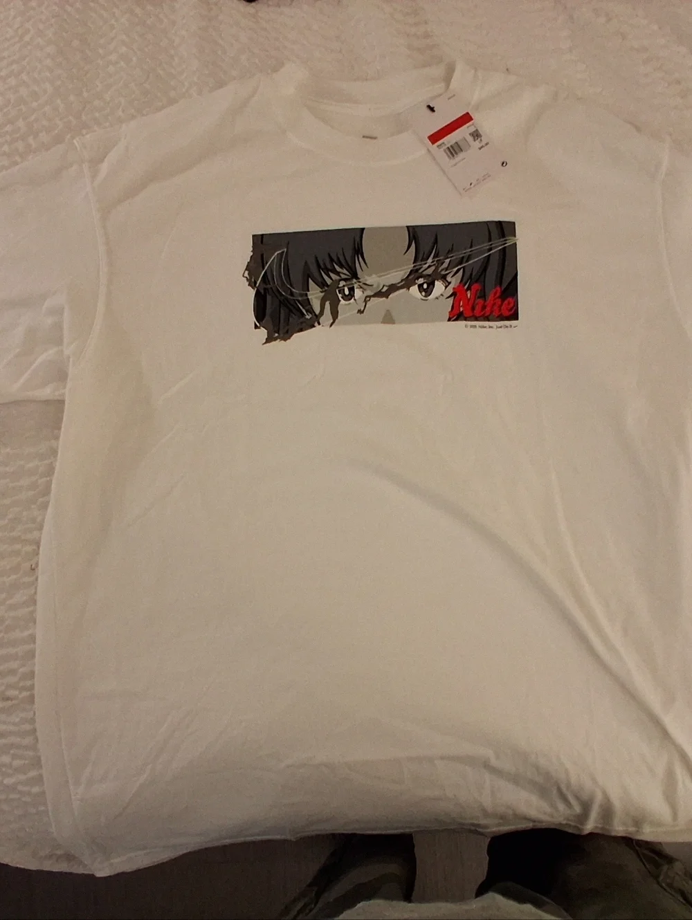 Nike White Short-Sleeve Tee with Anime Eyes Graphic